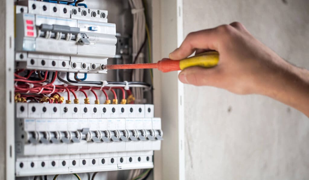 Electrician wiring electrical panel